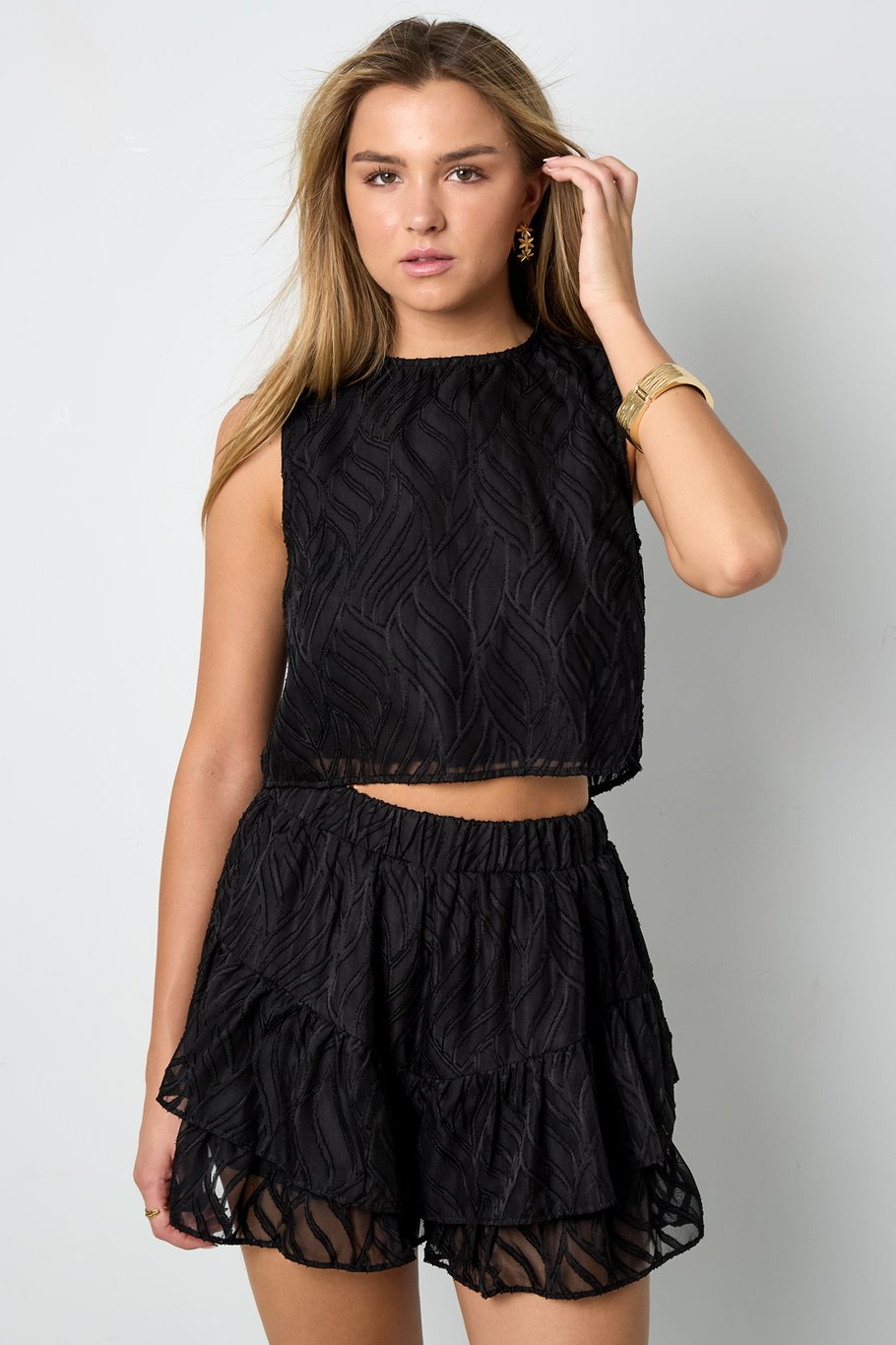 Mouwloze top bladeren